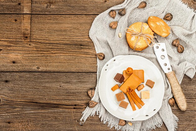 Norwegian brunost with cookies and nuts Healthy food and eating organic ingredient for breakfast