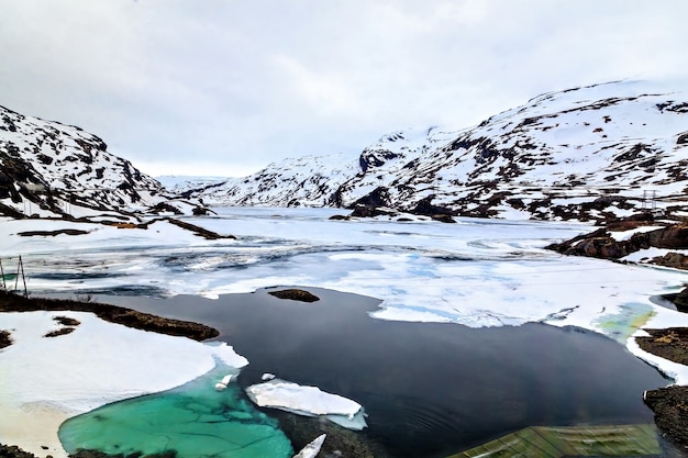 The norwegian landscape: icy lake and mountain