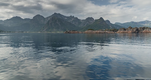 Norwegian seascape rocky coast with dramatic skies the sun breaks through the clouds sheer cliffs