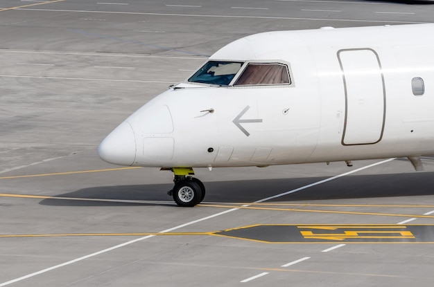 Nose and cockpit of the aircraft during taxiing on the runway