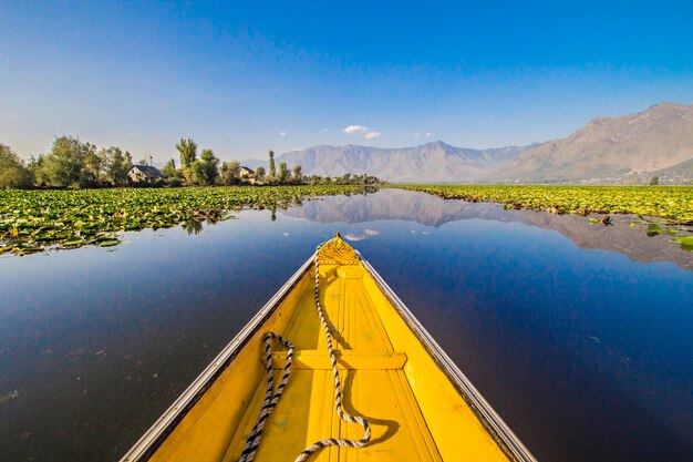 Nose of the wooden boat on the water of Dal lake in Srinagar, Kashmir, India