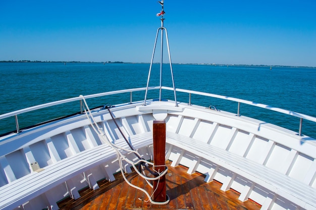 The nose of the yacht on a background of blue sea