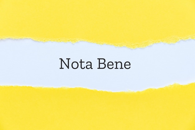 Nota bene typed on paper background for presentation slide