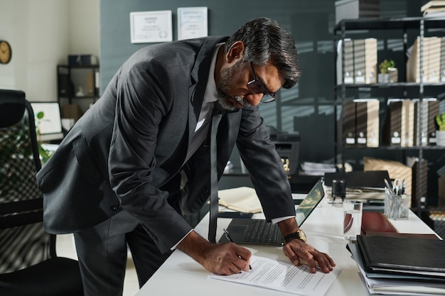 notary putting his signature on contract
