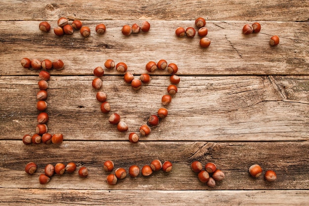 Note I Love made from hazelnuts on wood void