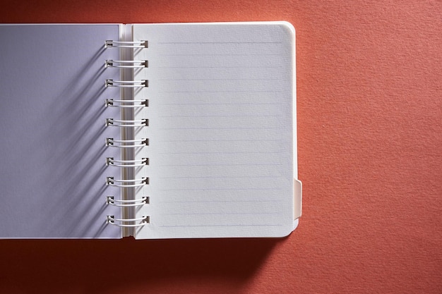 Note pad against red background