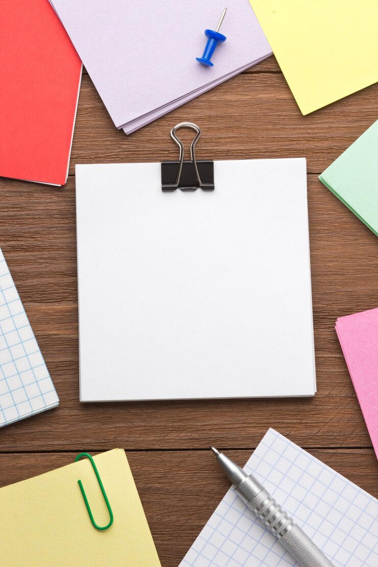 Photo note paper and office accessories on wood background