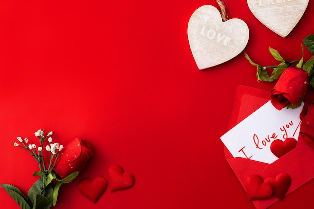 Note that says quotI love youquot inside an envelope with hearts and roses on red background