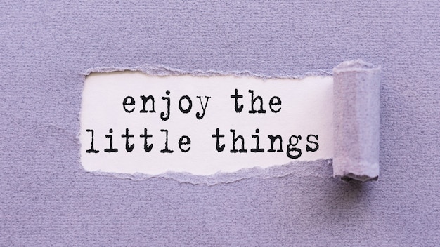Note on torn paper - Enjoy the little things - reminding us to appreciate even the simple moments in life