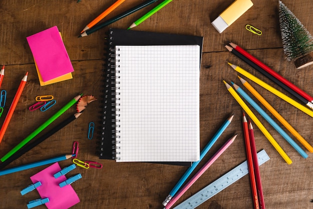 notebook and crayons on the desk