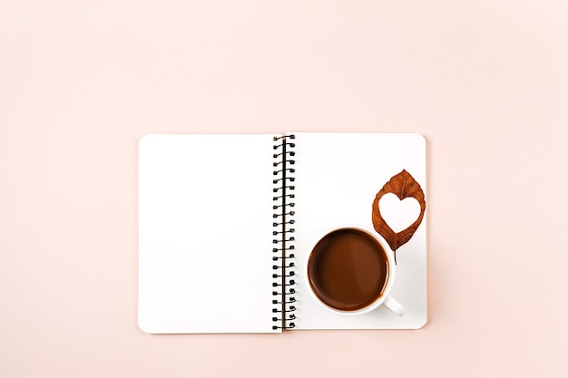 notebook, and cup of coffee