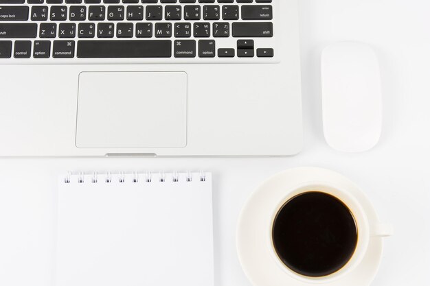 Notebook laptop and coffee cup