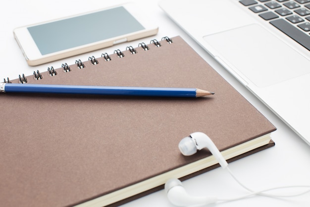 Notebook and Laptop on office desk