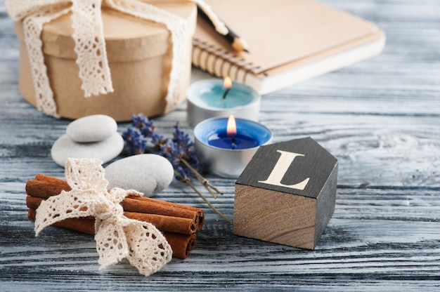 Notebook, lavender flowers, candles, pebble