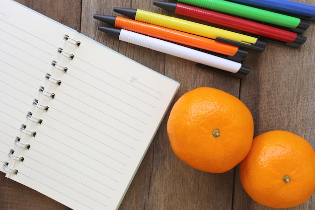 Notebook and mandarin oranges 