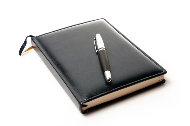 Notebook and pen isolated on a white background