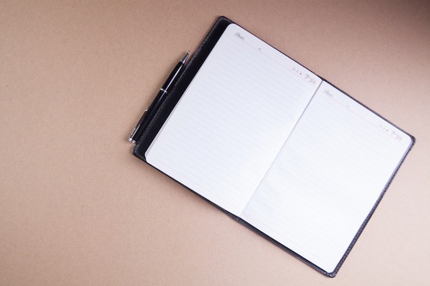 Notebook and pen on the table