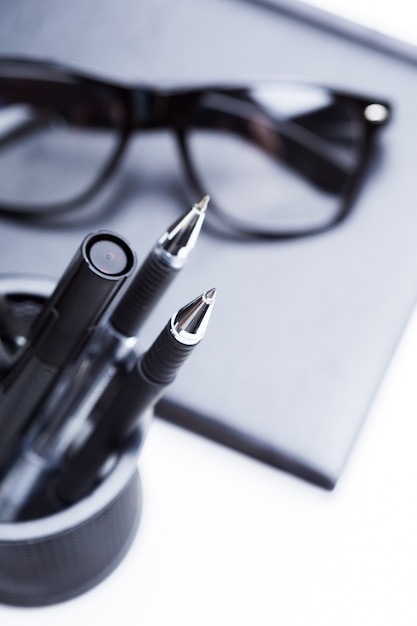 Photo notebook, pencil and glasses