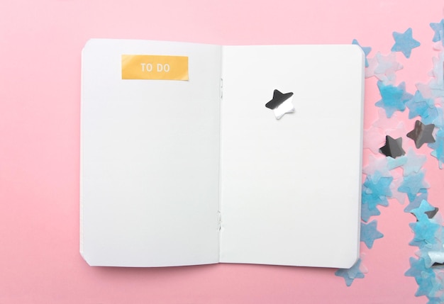 Notebook on pink background