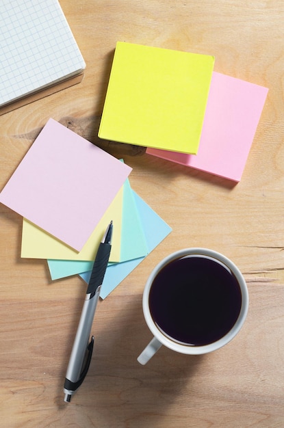 Notebook sticky notes and coffee