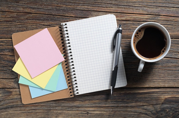 Notebook sticky notes and coffee