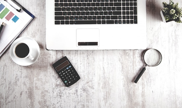 Notebook with calculator and coffee