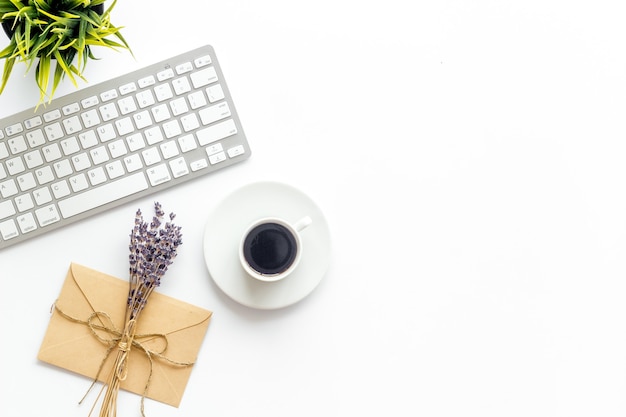 Notebook with  lavender flower branches and keyboard