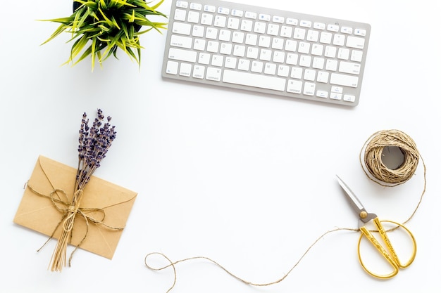 Notebook with  lavender flower branches and keyboard