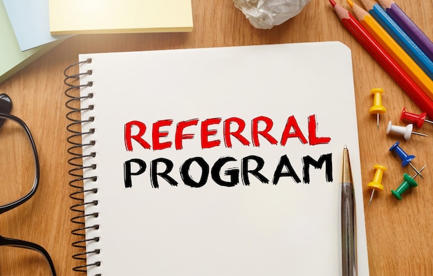 Notebook with Toolls and Notes about Referral Program