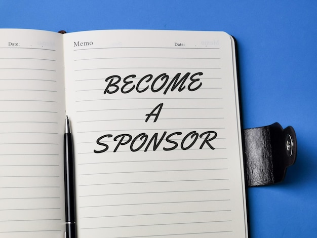 A notebook with the word become a sponsor on it