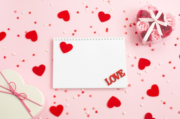 Notebook for writing with red hearts and gift boxes