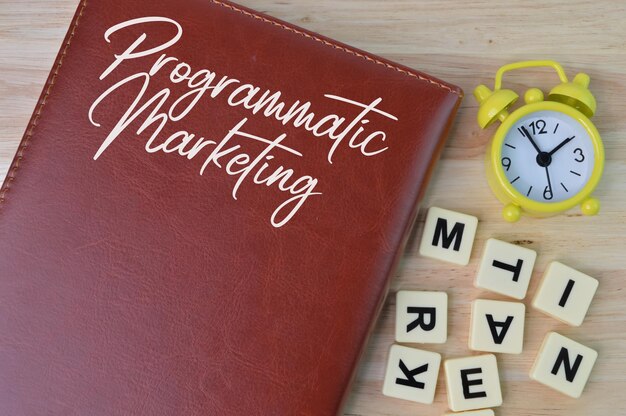 Notebook written with text PROGRAMMATIC MARKETING Top view