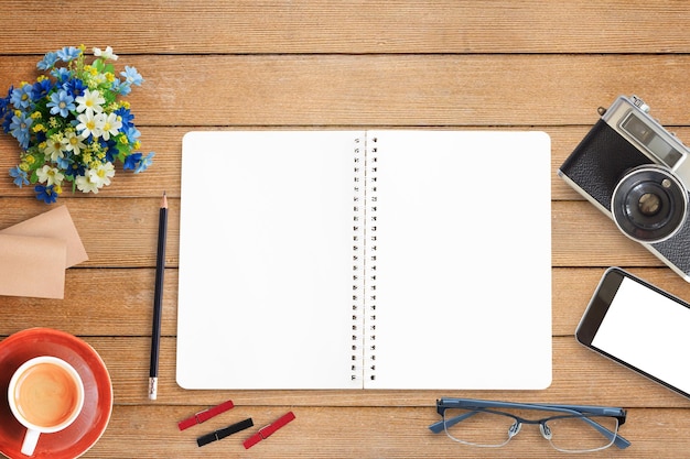 notebooks and coffee wood table background