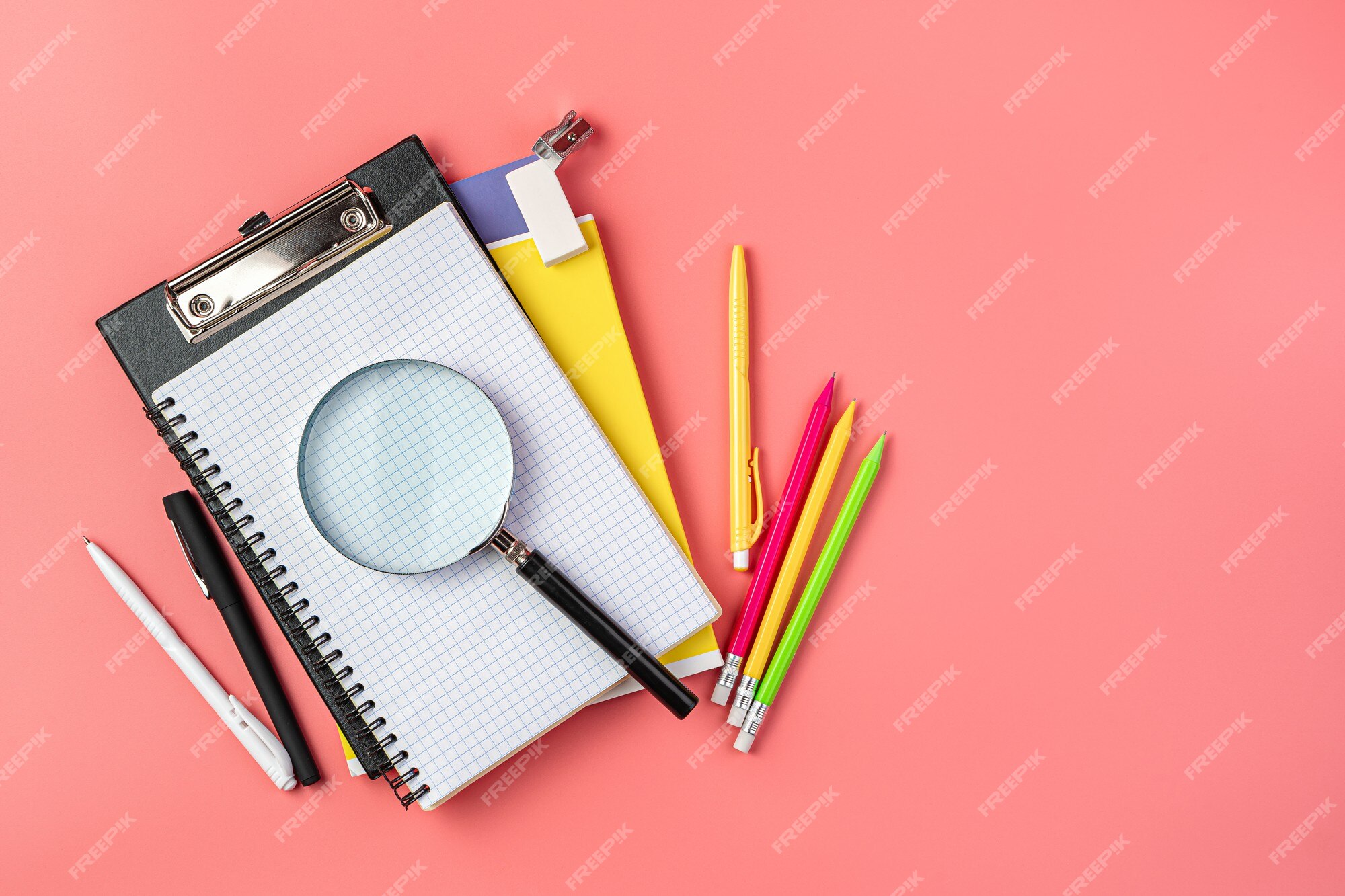 Premium Photo  School supplies with notebook on pink background
