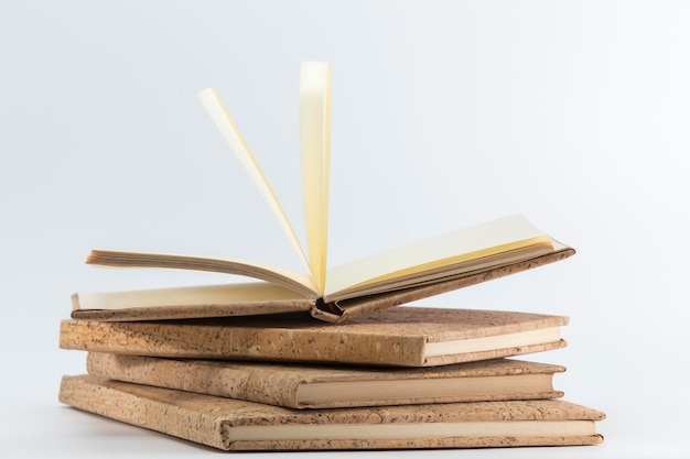 Notebooks with cork covers one open in the center