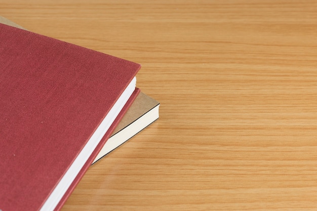 notebooks on the wood table.