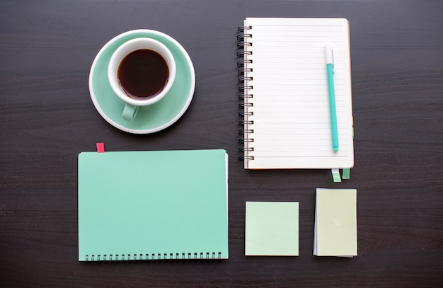 Notepad coffee and notebook on the table