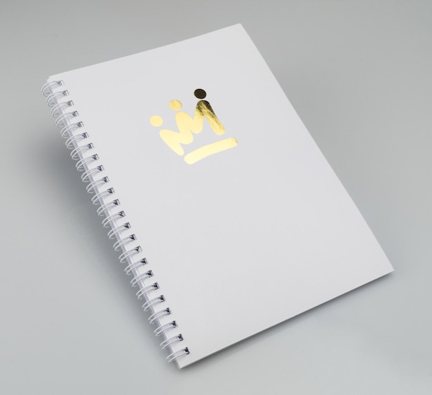 Notepad cover with the crown symbol on a white background