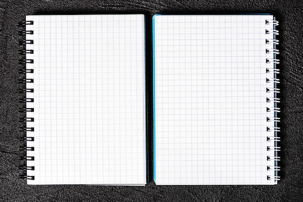 Notepad located on black background