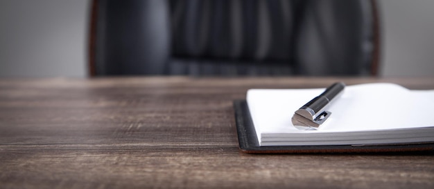 Notepad and pen on the business desk