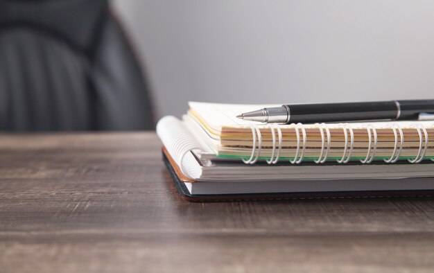 Notepad and pen on the business desk.