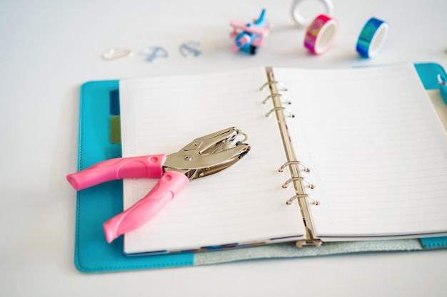 Notepad and stationery on white background Planner for business and study Fans of stationery