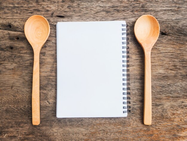 Notepad and two wooden spoons