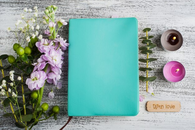 Notepad with flowers and candles