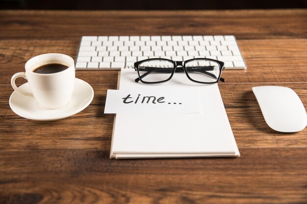 Notepad with inscription time keyboard and coffee