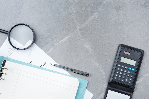 Notepad with a pen on a marble background