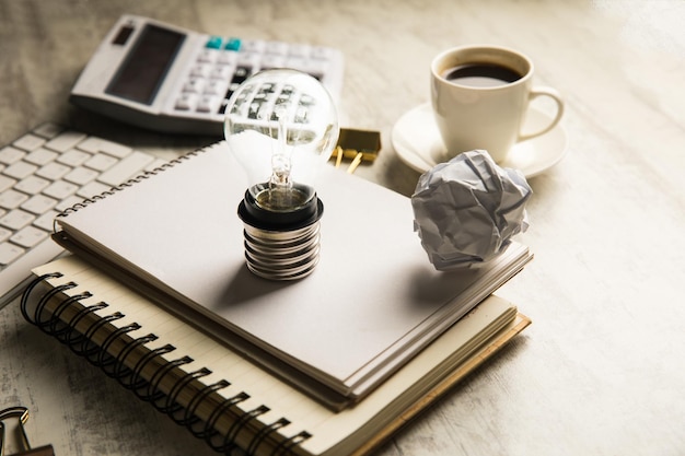 Notepads and light bulb