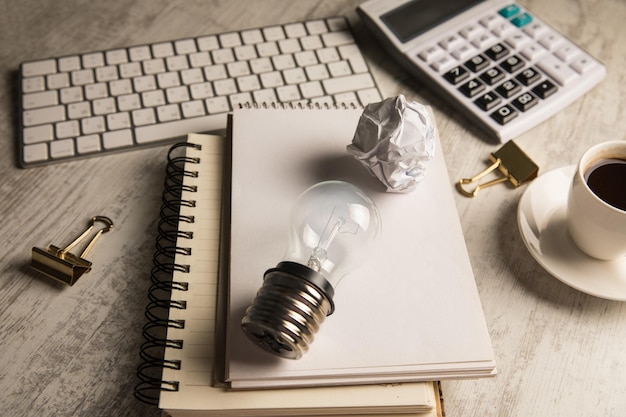 Notepads and light bulb