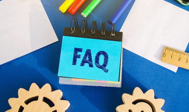 Notes with the inscription FAQ frequently asked questions