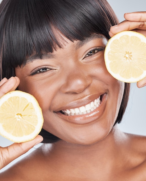 Nothing adds more value to my skin than vitamin c Studio shot of an attractive young woman holding a lemon to her face against a grey background